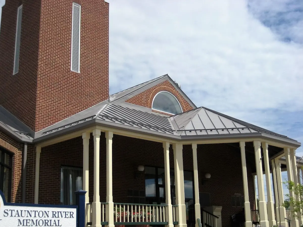Skilled roofing craftsmen working on a residential roof in Seymour